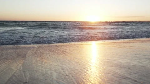 Beautiful ocean waves crash into a sandy beach during sunrise in tropical Punta Stock Footage 300415752