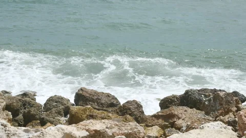 Beautiful ocean waves hit rocks near Pandawa Beach, Bali - 4K, Handheld Stock Footage 185597148