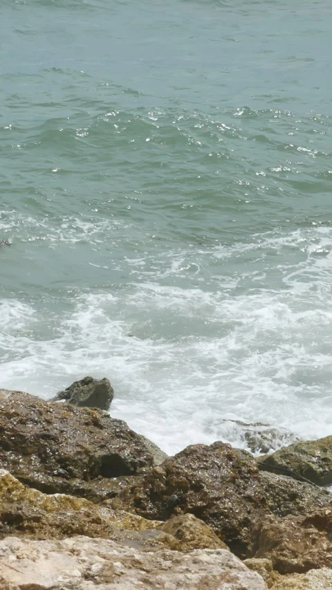 Beautiful ocean waves hit rocks near Pandawa Beach, Bali - 4K, Handheld Stock Footage 303380482