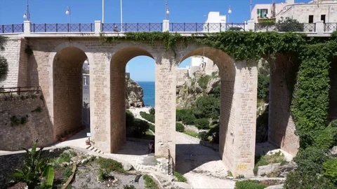 Beautiful old bridge in Polignano a Mare, Puglia region, Italy Stock Footage 75840293