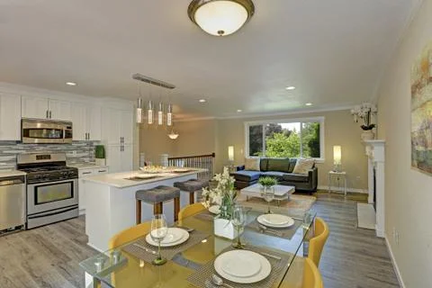 Beautiful open plan second floor living room, kitchen and dining space. Kitch Stock Photos