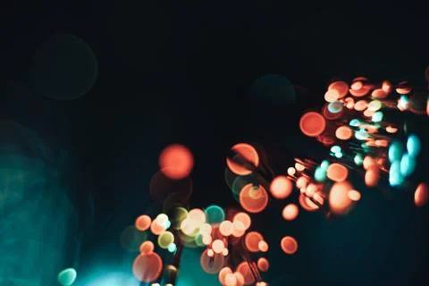 Beautiful optical fiber blue cold bokeh on a dark background. Stock Photos