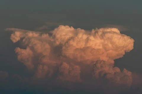 Beautiful orange clouds with dramatic light and blue sky. Stock Photos