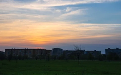 Beautiful Orange Red Sky Clouds At Dusk Sunset With housing estate Background. Stock Footage 97504676