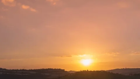 Beautiful orange sky with moving clouds and sun go down. 스톡 동영상 106803109