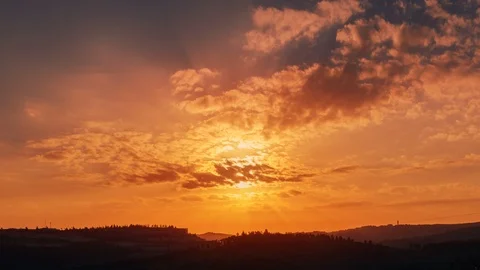 Beautiful orange sky with moving clouds and sun go down. Time lapse shot in Video stock 106915864
