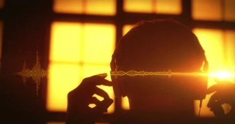 Beautiful Orange Slow Motion Concept Musician Putting on Headphones and Video stock 134907423