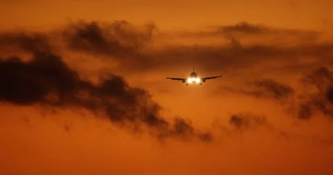 Beautiful orange sunset landscape with a flying cargo plane. Transport cargo Stock Footage 230074830