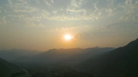 Beautiful orange sunset with mountains in the background Stock Footage 285549232