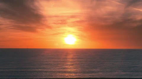 Beautiful Orange Sunset Ocean Timelapse Colorful Sky Sun Setting on Water 4K Stock Footage 45174656