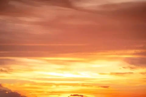 Beautiful orange sunset sky with clouds and warm colors Stock Photos