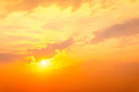 Beautiful orange sunset sky with clouds at dusk Stock Photos