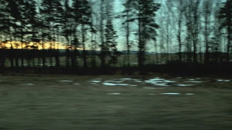 Beautiful orange sunset while riding the train, view from the window. Nature and Stock Footage 158141105