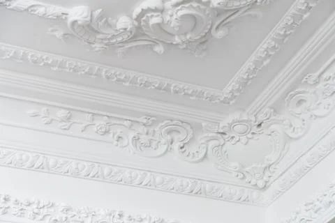 Beautiful ornate white decorative plaster moldings in studio Stock Photos