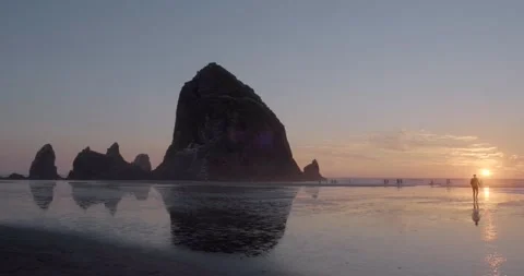 Beautiful Pacific coast Sunset with haystack rock, Cannon Beach, Oregon - 4K Stock Footage 219700096