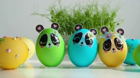 Beautiful painted and decorated Easter eggs on the table against the backdrop of Stock Footage 194171163