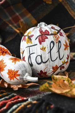 Beautiful painted autumn pumpkins. FALL writing on pumpkin. Autumn harvest. DIY. Stock Photos
