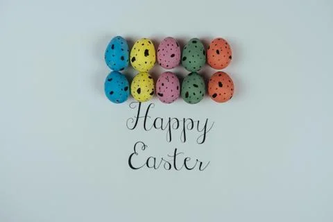 Beautiful painted Easter eggs and greeting card isolated on white background Stock Photos