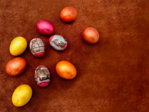 Beautiful painted Easter eggs on a brown background. Greeting card with Easte Stock Photos