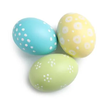 Beautiful painted Easter eggs on white background, top view Stock Photos