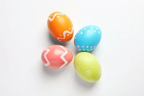 Beautiful painted Easter eggs on white background, top view 스톡 사진