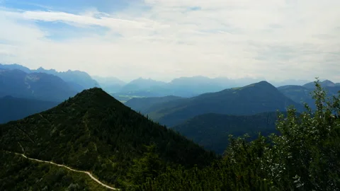 Beautiful panorama shot of mountain range area showing summit in summertime. Video stock 139607828