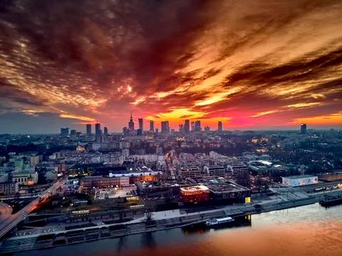 Beautiful panoramic aerial drone dramatic sunset view to Warsaw city center w Stock Photos