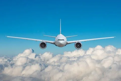 Beautiful panoramic background clouds cumulus with flying plane in blue sky.  Stock-Fotos