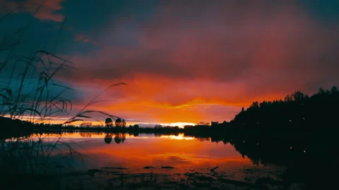 Beautiful panoramic sunset reflecting on small pond in North Pole, Alaska. Stock Footage 139150335