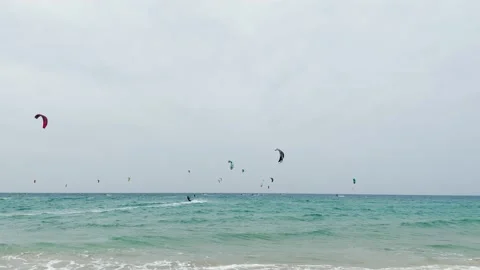 Beautiful panoramic view of the blue ocean with kitesurfers Stock Footage 146585926