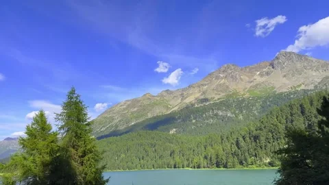 Beautiful Panoramic View over Lake Champfèr and Swiss Alps with Blue Sky Stock Footage 287212307