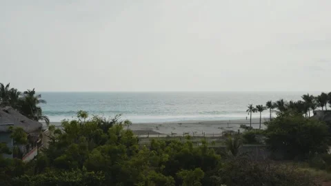 Beautiful panoramic view of the pacific ocean waves rolling onto a sandy beach Video stock 343873992