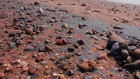 Beautiful panoramic view from stones to the red beach with mountains and Persian Stock Footage 104858147