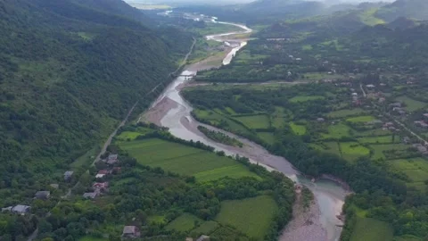 Beautiful panoramic views of the winding mountain river and surrounding fields Stock Footage 150972903