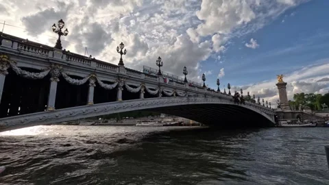 Beautiful Paris Bridge Timelapse During Daytime With Cloudy Sky and River Stock Footage 276375616