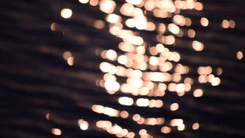 Beautiful pattern of defocused sun path on water Stock Footage 76274045