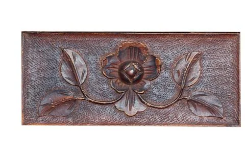 Beautiful pattern in the form of a flower and leaves on a wooden Board. Carvi Stock Photos
