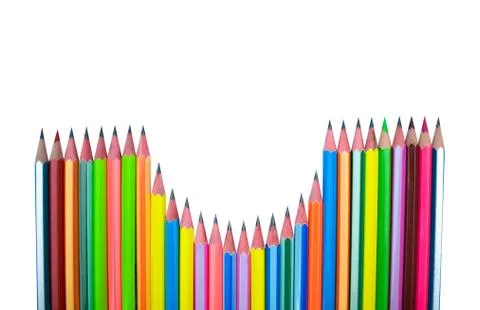 Beautiful pattern made with different colored wood pencil crayons on white ba Stock Photos