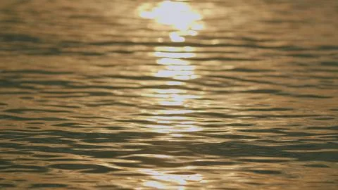 Beautiful Pattern Of Water Reflecting Sun. Beautiful Ripples On Water. Shining 스톡 사진