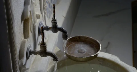 Beautiful patterned bowl close-up stands on the edge of a chic large sink filled Stock Footage 112045168