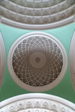 Beautiful patterned ceiling in an old abandoned palace. Stock Photos