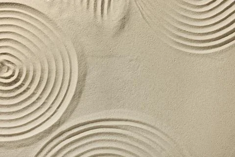 Beautiful patterns drawn on sand, top view with space for text. Zen garden Stock Photos