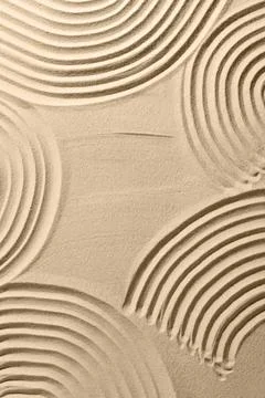 Beautiful patterns drawn on sand, top view. Zen garden Stock Photos
