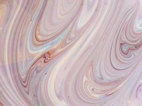 Beautiful patterns when mixing paints of different colors. Stock Photos
