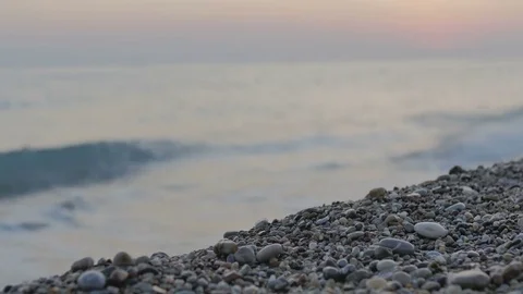 Beautiful pebble beach with large waves and foam. Video with the sound of waves Stock Footage 80138103