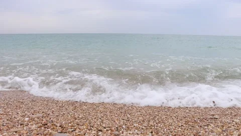 Beautiful pebble beach with sea waves Stock Footage 219212084