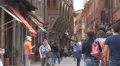 Beautiful pedestrian street Old Town Bologna Italy ancient shopping area tourism HD Footage