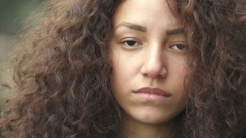 Beautiful pensive and sad Hispanic woman closeup portrait Stock Footage