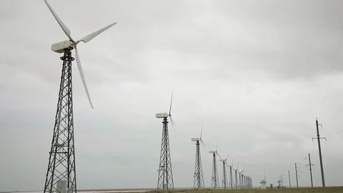 Beautiful perspective view on wind generators, cloudy grey sky bg, wide angle 動画素材 97101305