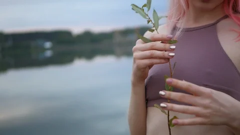 Beautiful pink haired model posing in swimsuit at sunset. Stock Footage 100606788
